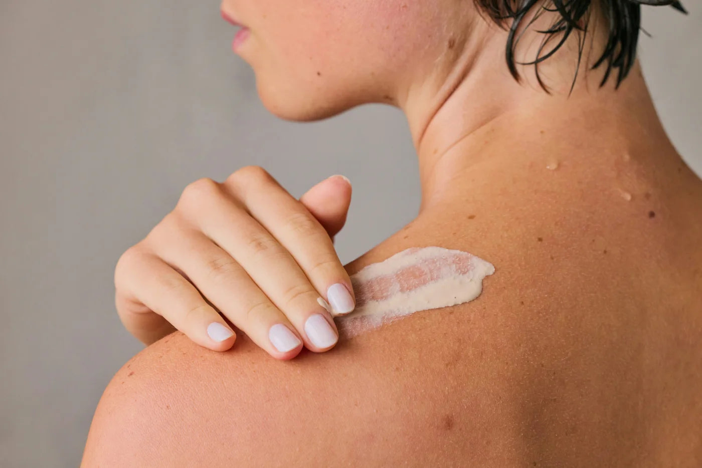 Relief Balm being smoothed onto a shoulder
