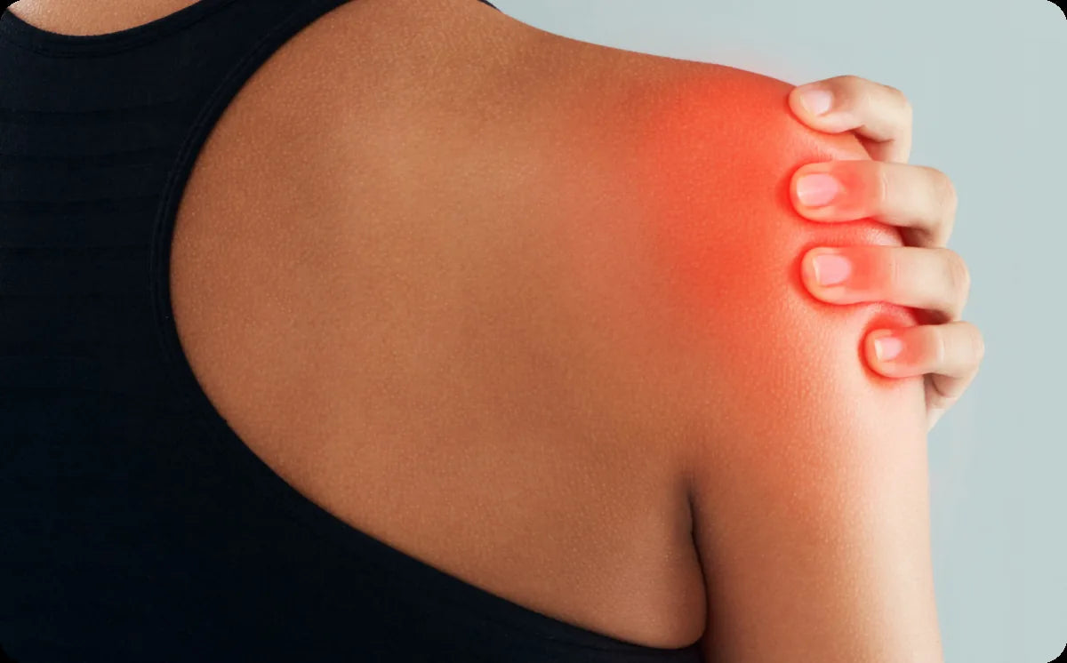 Hands massaging a sore shoulder