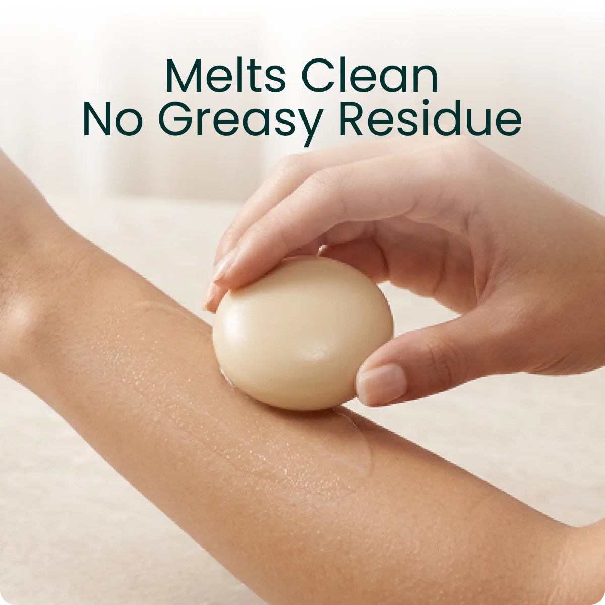 Emu oil melting into skin. Text on the image: Melts Clean, No Greasy Residue