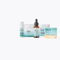 The Soothe My Lichen Sclerosus Kit lineup: On The Go Stick, Soothe My Skin jar, Emu Oil bottle, Relief Balm jar and Emu Oil Soap