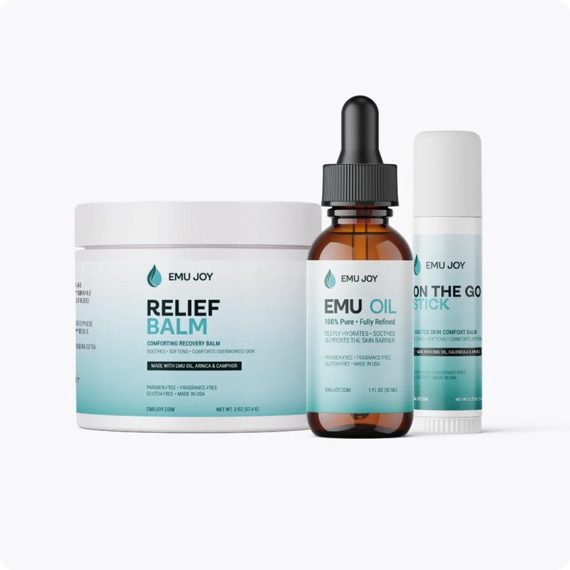The Soothe My Pain Kit lineup: Relief Balm jar, Emu Oil bottle and On The Go Stick