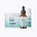 The Soothe My Pain Kit lineup: Relief Balm jar, Emu Oil bottle and On The Go Stick