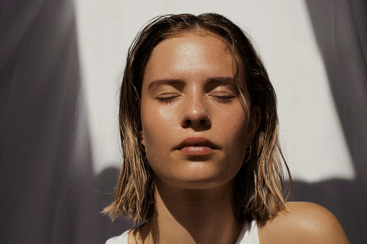 Woman with closed eyes in soft natural light