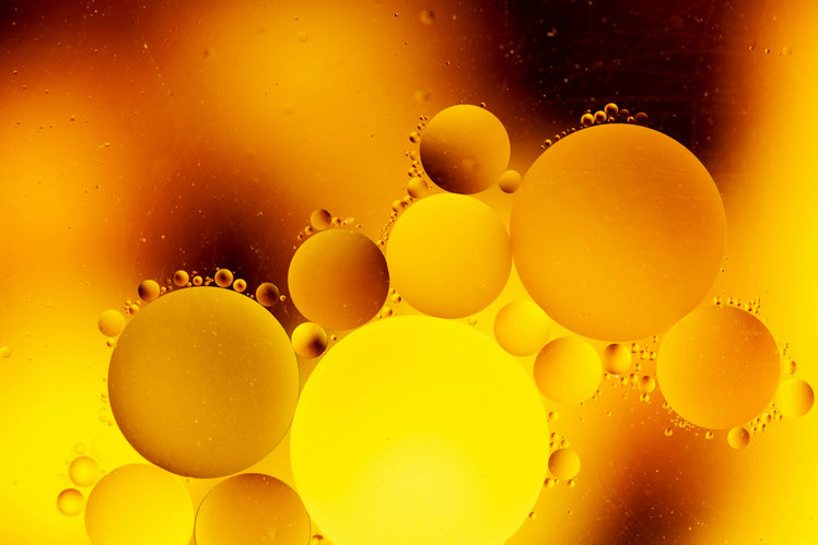 Golden emu oil bubbles in macro close-up