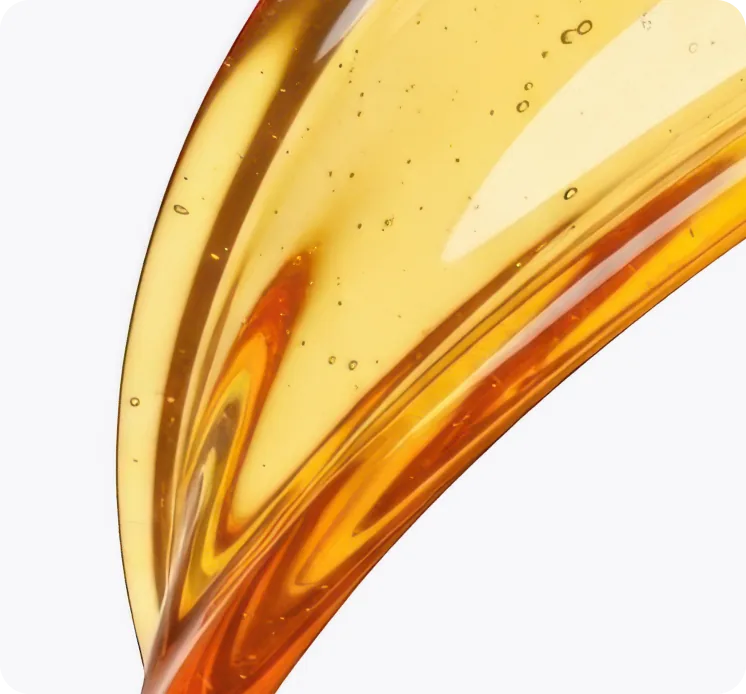 Golden emu oil pouring in a smooth ribbon