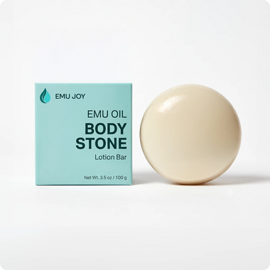 The Emu Joy Emu Oil Body Stone lotion bar standing beside its mint green box, net wt. 3.5 oz
