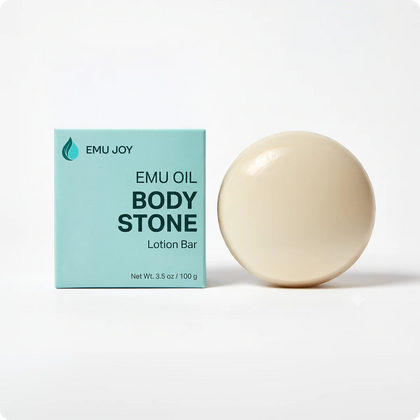 The Emu Joy Emu Oil Body Stone lotion bar standing beside its mint green box, net wt. 3.5 oz