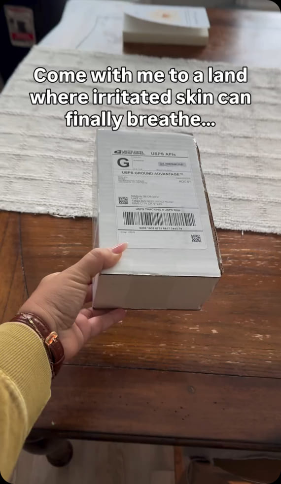 Customer video: a hand holding an Emu Joy shipping box, captioned "Come with me to a land where irritated skin can finally breathe"
