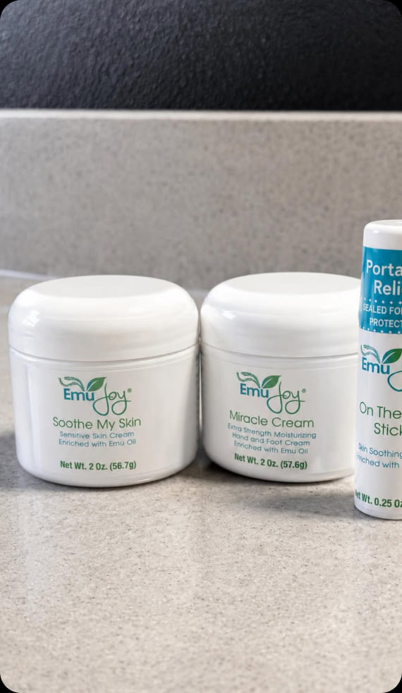 Soothe My Skin and Miracle Cream tubs with an On The Go Stick on a bathroom counter