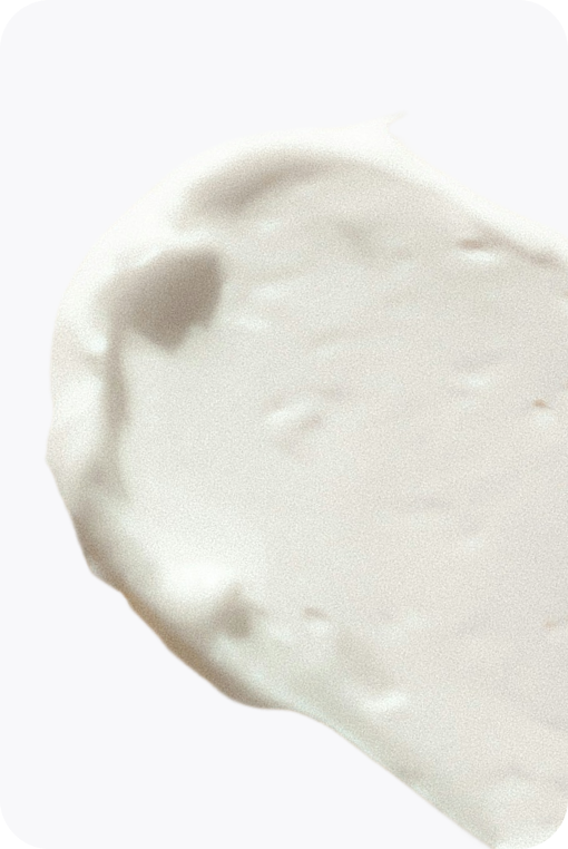 Smear of Emu Joy cream on a soft grey card