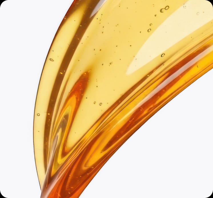 Close-up swipe of clear golden emu oil